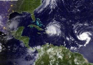hurricane over map of the Atlantic Ocean, North America, Central America, and South America