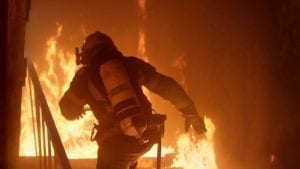 Fireman running into a burning building