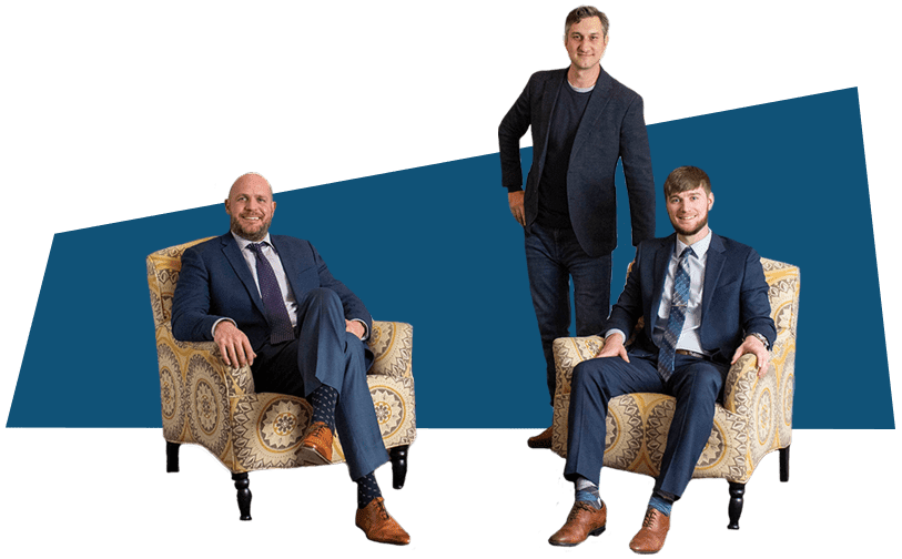 Three professionals sitting in chairs